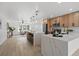Bright, open kitchen boasts a double waterfall island, modern appliances, and seamless flow to living area at 4210 Palm Dr, Punta Gorda, FL 33950