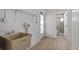 This laundry room features utility sink and an entryway to an adjacent bathroom at 4210 Palm Dr, Punta Gorda, FL 33950
