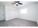 Clean bedroom design with closet, ceiling fan, and window for natural light at 4260 Saint Lawrence Dr, New Port Richey, FL 34655