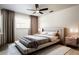 Staged bedroom with upholstered bed, bedside tables, and neutral decor at 4260 Saint Lawrence Dr, New Port Richey, FL 34655