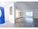 View of the foyer with a blue front door and natural light at 4260 Saint Lawrence Dr, New Port Richey, FL 34655
