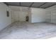 Clean, spacious garage with ample storage, ready for parking and projects, enhanced by bright lighting at 4260 Saint Lawrence Dr, New Port Richey, FL 34655