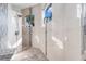 Detailed shower stall with mosaic accent tiles and two small windows at 4353 Dewey Dr, New Port Richey, FL 34652