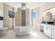 Luxurious bathroom featuring a soaking tub, tiled walls, and modern vanity at 4353 Dewey Dr, New Port Richey, FL 34652