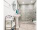 Bathroom featuring tiled shower, neutral walls, and modern hardware at 4353 Dewey Dr, New Port Richey, FL 34652