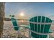 Enjoy spectacular sunset views from the beach on comfortable Adirondack chairs, complete with a small table at 4353 Dewey Dr, New Port Richey, FL 34652