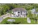 Expansive well maintained two-story home with manicured lawn and circular driveway at 4353 Dewey Dr, New Port Richey, FL 34652