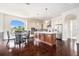 Spacious kitchen with stainless steel appliances, large island, and adjacent dining area at 4353 Dewey Dr, New Port Richey, FL 34652