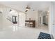 Bright, airy living room features a bar, arched entryways, and sleek tile flooring at 4353 Dewey Dr, New Port Richey, FL 34652