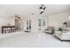 Spacious living area with marble floors, wet bar, and access to the patio at 4353 Dewey Dr, New Port Richey, FL 34652