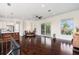 Open living room with dark wood floors and a balcony at 4353 Dewey Dr, New Port Richey, FL 34652