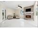 An interior of the living room with a stone fireplace and chairs for relaxing at 4353 Dewey Dr, New Port Richey, FL 34652