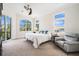Spacious main bedroom with multiple windows, a sitting area, and neutral carpet at 4353 Dewey Dr, New Port Richey, FL 34652