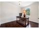 Office features wood floors, natural light, and a simple desk at 4353 Dewey Dr, New Port Richey, FL 34652