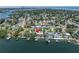 The aerial view displays the home's waterfront location with boat dock and easy access to the water at 4649 Neptune Se Dr, St Petersburg, FL 33705
