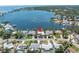 An aerial view shows the home's location on the water with boat dock and convenient boat access at 4649 Neptune Se Dr, St Petersburg, FL 33705