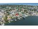 An aerial view shows the home's location directly on the water with easy boating access at 4649 Neptune Se Dr, St Petersburg, FL 33705