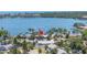 Aerial shot displays the house and its convenient access to the waterfront with boat dockage at 4649 Neptune Se Dr, St Petersburg, FL 33705