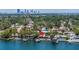 Stunning aerial view showcasing the waterfront property with a private dock and boat lift at 4649 Neptune Se Dr, St Petersburg, FL 33705