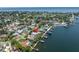 An aerial view shows the home's location directly on the water with easy boating access at 4649 Neptune Se Dr, St Petersburg, FL 33705