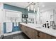 This bathroom includes a double sink vanity and a large frameless shower at 4649 Neptune Se Dr, St Petersburg, FL 33705