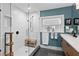 A frameless glass shower sits next to a modern vanity in this bathroom at 4649 Neptune Se Dr, St Petersburg, FL 33705