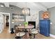 Cozy dining area with stylish lighting, a marble fireplace and modern furnishings offers a comfortable ambiance at 4649 Neptune Se Dr, St Petersburg, FL 33705