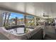 Covered patio featuring a relaxing hot tub with views of the waterfront at 4649 Neptune Se Dr, St Petersburg, FL 33705
