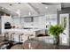 Bright kitchen featuring an island with bar seating, modern appliances, and a sleek design at 4649 Neptune Se Dr, St Petersburg, FL 33705