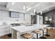 Spacious open kitchen with a stone island, stainless steel appliances, pendant lighting, and ample counter space at 4649 Neptune Se Dr, St Petersburg, FL 33705