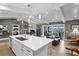 Bright open-concept living room features a fireplace, a kitchen island, and sliding doors leading to the outside at 4649 Neptune Se Dr, St Petersburg, FL 33705