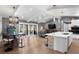 Open-concept living space with water views, a modern kitchen, and a dining area with stylish decor at 4649 Neptune Se Dr, St Petersburg, FL 33705
