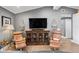 Stylish living room features hardwood floors, designer lighting and a large screen TV for your enjoyment at 4649 Neptune Se Dr, St Petersburg, FL 33705