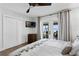 This main bedroom features private outdoor access, hardwood floors, and neutral colors at 4649 Neptune Se Dr, St Petersburg, FL 33705