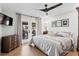 This main bedroom has hardwood floors and access to the outdoor patio at 4649 Neptune Se Dr, St Petersburg, FL 33705