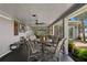 Covered patio with outdoor dining set, perfect for enjoying the backyard view at 4649 Neptune Se Dr, St Petersburg, FL 33705