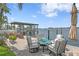Scenic waterfront patio with comfortable seating, offering stunning views of the boat dock and water at 4649 Neptune Se Dr, St Petersburg, FL 33705