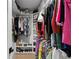 This walk-in closet features ample shelving, hanging rods, and shoe storage at 4649 Neptune Se Dr, St Petersburg, FL 33705