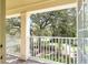 Balcony view showcasing lush greenery, mature trees, and a tranquil outdoor setting at 5401 Match Point Pl, Lithia, FL 33547