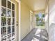 Spacious balcony with view, featuring neutral stucco and white railings, connecting to interior rooms at 5401 Match Point Pl, Lithia, FL 33547