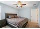 Serene bedroom with ceiling fan, and warm bedding, creating a relaxing and inviting atmosphere at 5401 Match Point Pl, Lithia, FL 33547