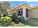 Exterior view of the home's patio, yard, and architectural details at 5401 Match Point Pl, Lithia, FL 33547