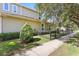 Attractive home exterior featuring well-kept landscaping and a charming fence at 5401 Match Point Pl, Lithia, FL 33547