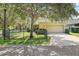 Charming home featuring a two-car garage and a meticulously maintained front yard at 5401 Match Point Pl, Lithia, FL 33547