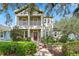 Charming two-story home featuring a inviting front porch and landscaped front yard at 5401 Match Point Pl, Lithia, FL 33547