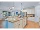 Spacious kitchen island with granite countertops, sink, and breakfast bar seating at 5401 Match Point Pl, Lithia, FL 33547