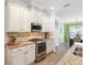 Bright kitchen showcases stainless steel appliances, granite counters and ample cabinet storage at 5401 Match Point Pl, Lithia, FL 33547