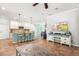 Open floor plan living space with an island separating it from the kitchen and an entertainment center at 5401 Match Point Pl, Lithia, FL 33547