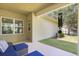 Inviting covered patio with comfortable seating and a grassy backyard at 5401 Match Point Pl, Lithia, FL 33547