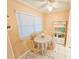 Bright breakfast nook featuring a round table, four chairs, and natural light from a window at 6060 Shore S Dr # 906, Gulfport, FL 33707